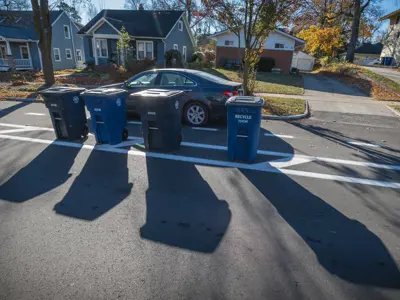 Photo of bike lane between parking lane and buffer; carts go in buffer. 
