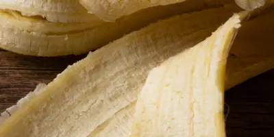 Banana peel in front of dark background